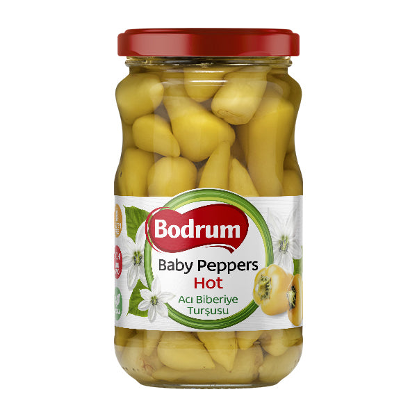 Jar of Bodrum baby peppers with a red lid on a white background