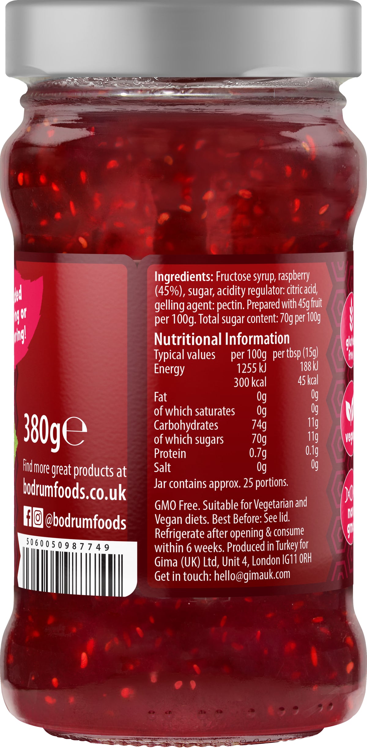 Jar of red jelly with a label showing nutritional information and branding.
