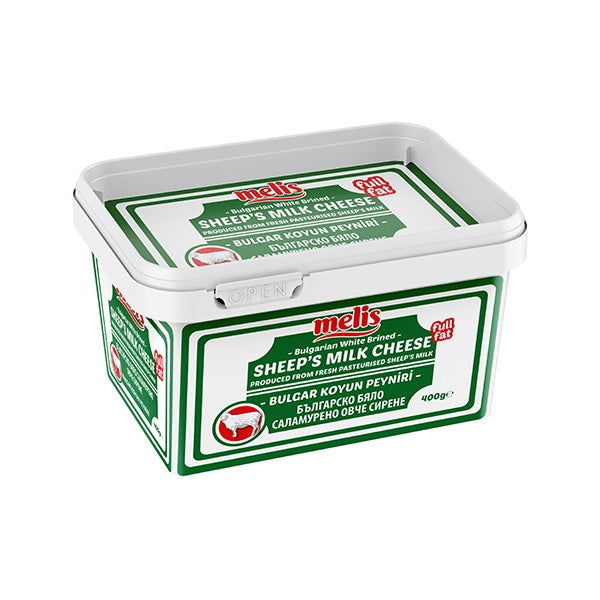 Bucket of Melis sheep's milk cheese on a white background