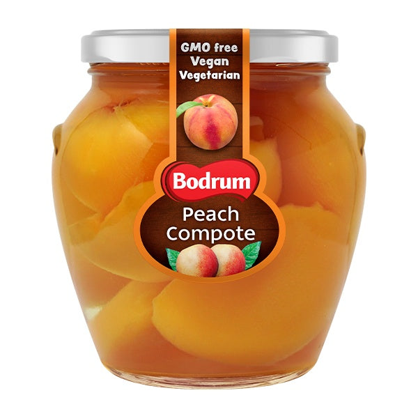 Jar of Bodrum Peach Compote with peach slices inside on a white background