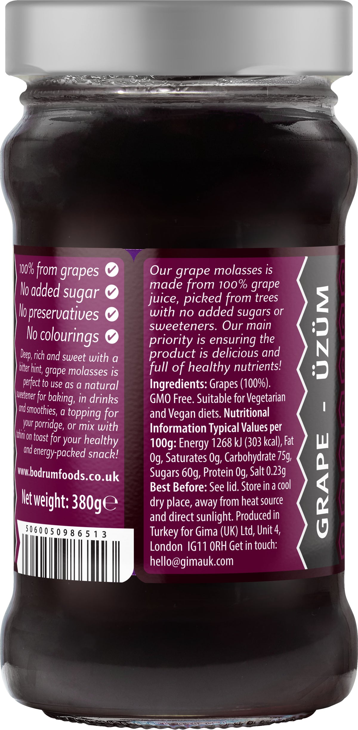 Jar of grape molasses with a purple label on a white background