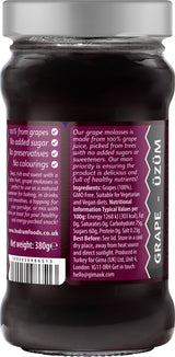 Jar of grape molasses with a purple label on a white background