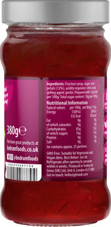 Jar of jam with a label showing ingredients and nutritional information.