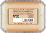 Container of halva with a label on the back