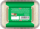 Container of halva with a green label displaying text and a barcode.