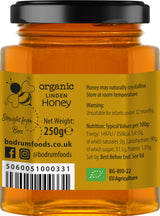 Jar of organic linden honey with label showing brand details and nutritional information.