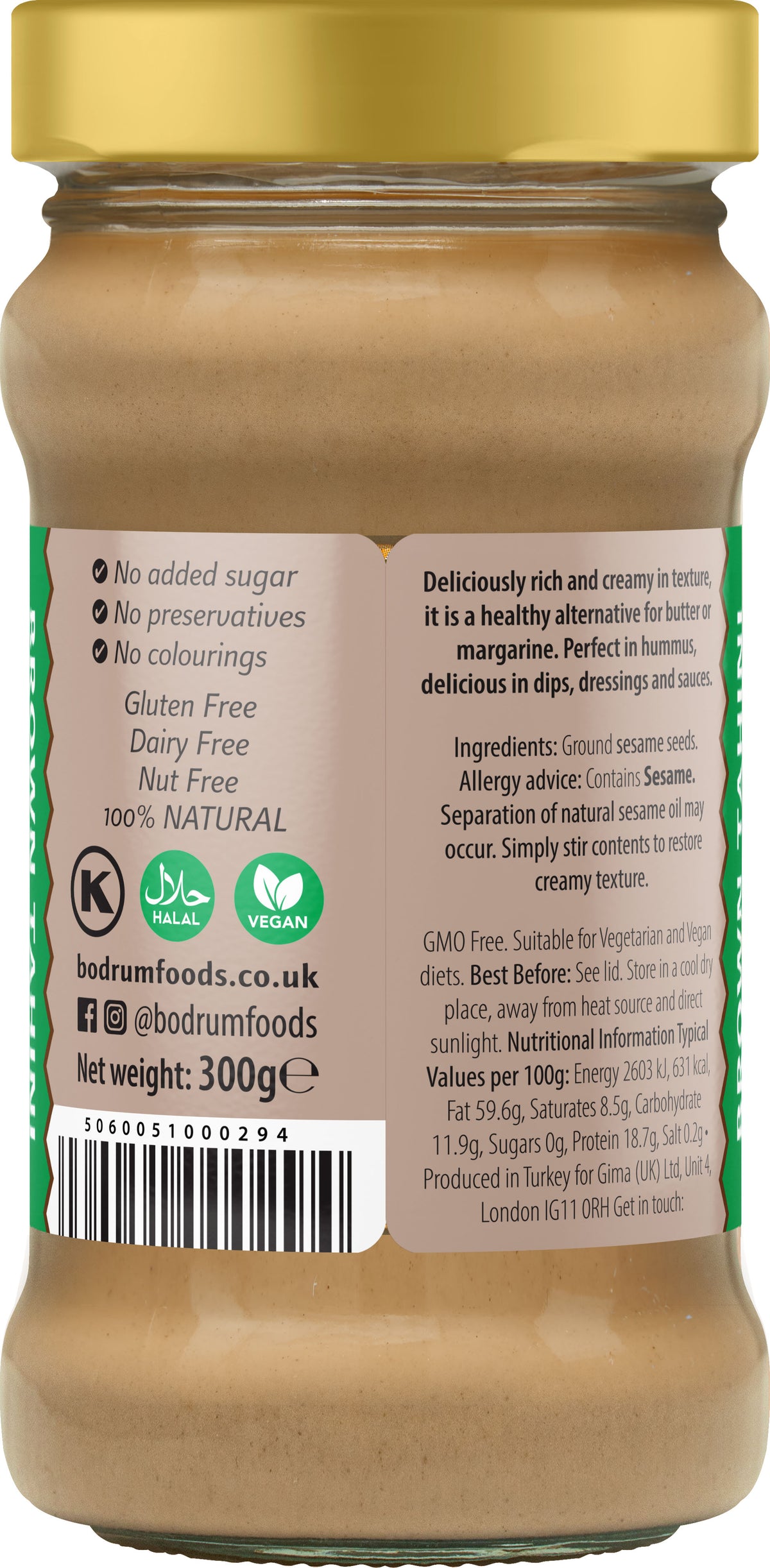 Jar of peanut butter with a gold lid and label detailing nutritional information and ingredients.