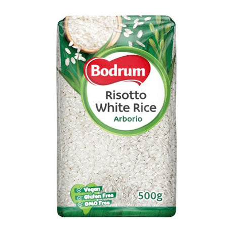 A 500g package of Bodrum Risotto White Rice Arborio, featuring white rice visible through a clear window in a green and white package with a red and white Bodrum logo.